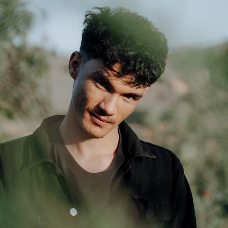 Asha Rao, Lead Design Curator at PoliteSignalBay, reviewing corporate floral arrangements